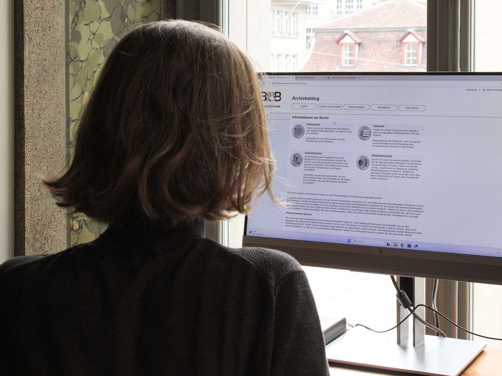 Person in the reading room at the research station.